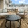 a deck with chairs and tables