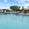 a pool with a deck and chairs
