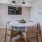 a dining room table with chairs and a chandelier