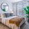 a bedroom with a large mirror