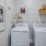 A laundry room with washer and dryer at Attain at Bradford Creek apartments in Huntsville.