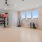 a room with a large treadmills and a large window